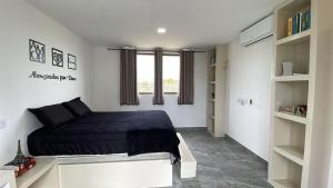 Ένα ή περισσότερα κρεβάτια σε δωμάτιο στο Casa de praia em condomínio fechado, a 5min do mar