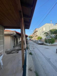 a view of an empty street with a house at Anastelia Apartments - The Backyard in Olympiada