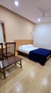 Voodi või voodid majutusasutuse Nandan Residency toas