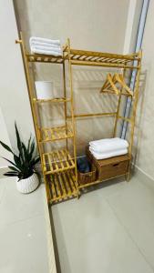 a yellow bunk bed in a room with a plant at Vela House Hatyai in Hat Yai +41 photos