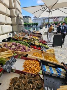 a market with many different types of vegetables on display at Premium Apartment mit Pilatus Sicht in Lucerne