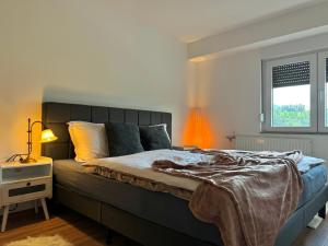 Postel nebo postele na pokoji v ubytování Ferienwohnung Conny