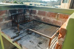 a metal bench sitting on top of a balcony at Domo 2 - Domos Aiken Chapa Glamping en Zona Cruz del Sur Chapadmalal para 2 PAX - Hola Sur in Mar del Plata