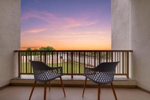 A balcony or terrace at Lemon Tree Resort, Somnath