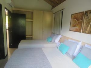 Ένα ή περισσότερα κρεβάτια σε δωμάτιο στο Vila encanto