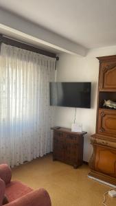 Μια τηλεόραση ή/και κέντρο ψυχαγωγίας στο As pontes apartamento +15 φωτογραφίες