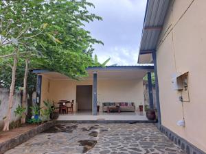 a view from the outside of a house with a patio at Lembah Hijau in Senggigi