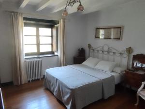 Cama o camas de una habitación en Hotel Rural Natxiondo