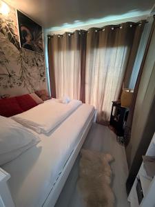 Posteľ alebo postele v izbe v ubytovaní Tiny House am Neusiedlersee + 25 fotografií