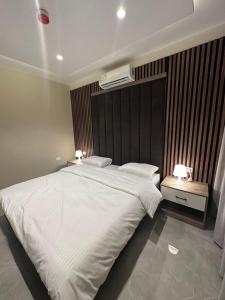Ένα ή περισσότερα κρεβάτια σε δωμάτιο στο Chic Apartments For Rent ave1-2