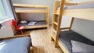 Postel nebo postele na pokoji v ubytování Orličky Apartments