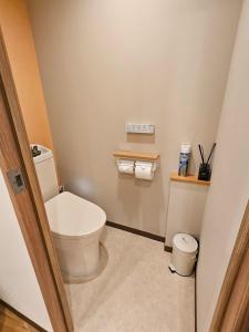 a small bathroom with a toilet in a room at Asakusa Stay in Tokyo