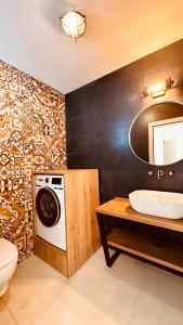 Ένα μπάνιο στο Vista Villas Apartment Endless Summer