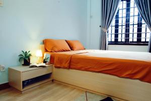 Postel nebo postele na pokoji v ubytování Susu Homestay Hue