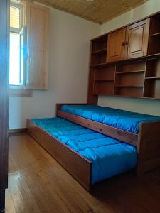 Postel nebo postele na pokoji v ubytování Casa 3 Irmãs