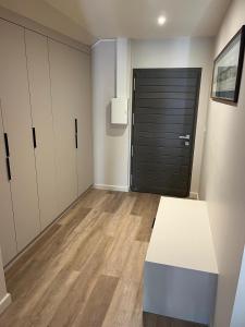 a room with a white table and a black door at Élégance Paloise in Pau +2 photos