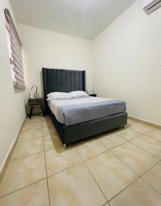 Postel nebo postele na pokoji v ubytování Agradable Departamento San Rafael