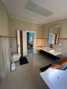 a bathroom with a sink and a toilet and a mirror at Happy Land Belek in Belek