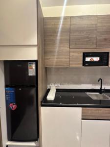 Η κουζίνα ή μικρή κουζίνα στο Chic Apartments For Rent ave1-7 +5 φωτογραφίες