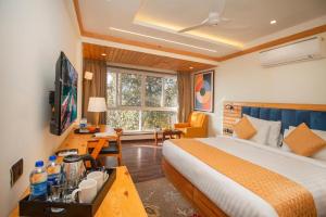 Postel nebo postele na pokoji v ubytování Baris resort Mussoorie