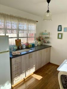a kitchen with a sink and a counter top at Suits יחידת נופש מתוקה באילת in Eilat