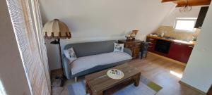 a living room with a couch and a table at Unska Bajka Bihać in Bihać