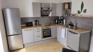 Kuchyň nebo kuchyňský kout v ubytování Dschungel-Apartment Steubenstr 13 + 8 fotografií
