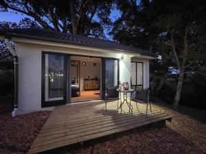 a wooden deck with a table and chairs on it at Sedgelow in Sedgefield