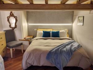 Postel nebo postele na pokoji v ubytování Cà Ro - Casa Rosetta "Mini house"