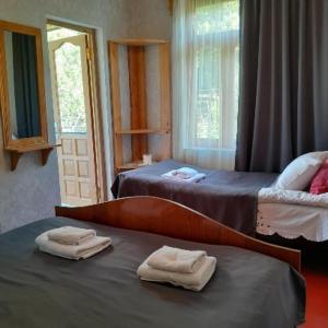 Postel nebo postele na pokoji v ubytování Guesthouse Sumaisha