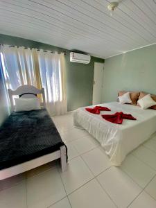 Postel nebo postele na pokoji v ubytování Pousada Caribe do Frances