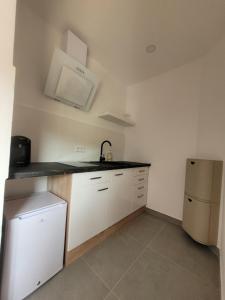 Kuchyň nebo kuchyňský kout v ubytování Reload Apartments - FeWo2 im Remmeker Feld
