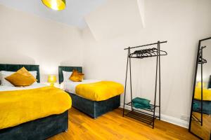 En eller flere senge i et værelse på Willes Road City House