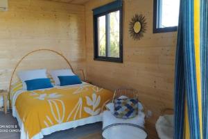 Postel nebo postele na pokoji v ubytování Évasion nature - Tiny house