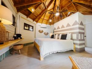 Letto o letti in una camera di Tranquilseas Eco Lodge & Dive Center