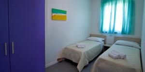 מיטה או מיטות בחדר ב-Residence Blumare