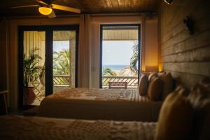 Letto o letti in una camera di Tranquilseas Eco Lodge & Dive Center