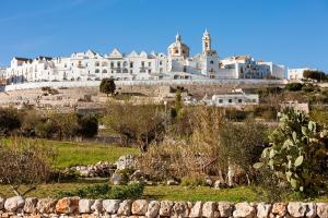 a large white building on top of a hill at Chicco di Grano in Locorotondo