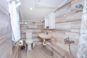 a bathroom with a toilet and a sink at Apartment Tom in Starigrad-Paklenica