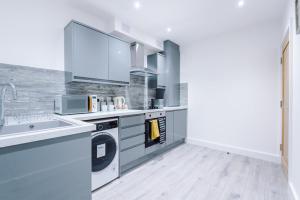 Kuchyň nebo kuchyňský kout v ubytování uniquejoe properties + 11 fotografií