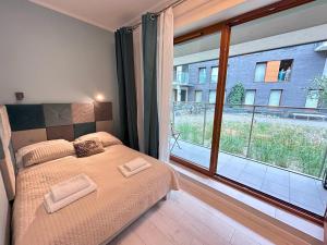 Posteľ alebo postele v izbe v ubytovaní ApartmentPrestige Central Station