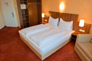 Rúm í herbergi á Hahn Hotel Vienna