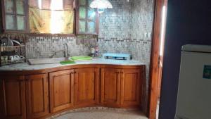 a kitchen with a sink and a counter top at Appart paillote2 bou ismail in Bou Ismaïl