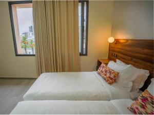 Posteľ alebo postele v izbe v ubytovaní Hotel Arabesque