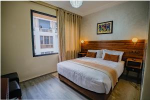 Posteľ alebo postele v izbe v ubytovaní Hotel Arabesque