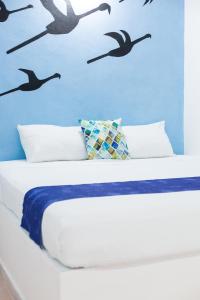 Postel nebo postele na pokoji v ubytování HOTEL LAS COLORADAS