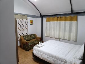 Rúm í herbergi á Hostal Ayllu