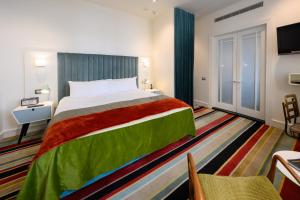 Giường trong phòng chung tại Hotel DeBrett