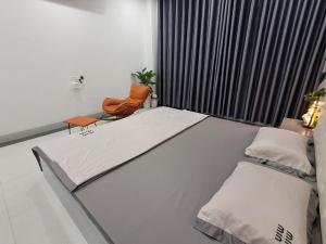 Ένα ή περισσότερα κρεβάτια σε δωμάτιο στο Homestay Ocean-T3