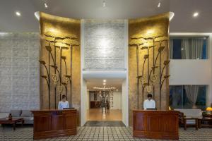 two people standing in front of a lobby at YASODHARAPURA Residence in Siem Reap